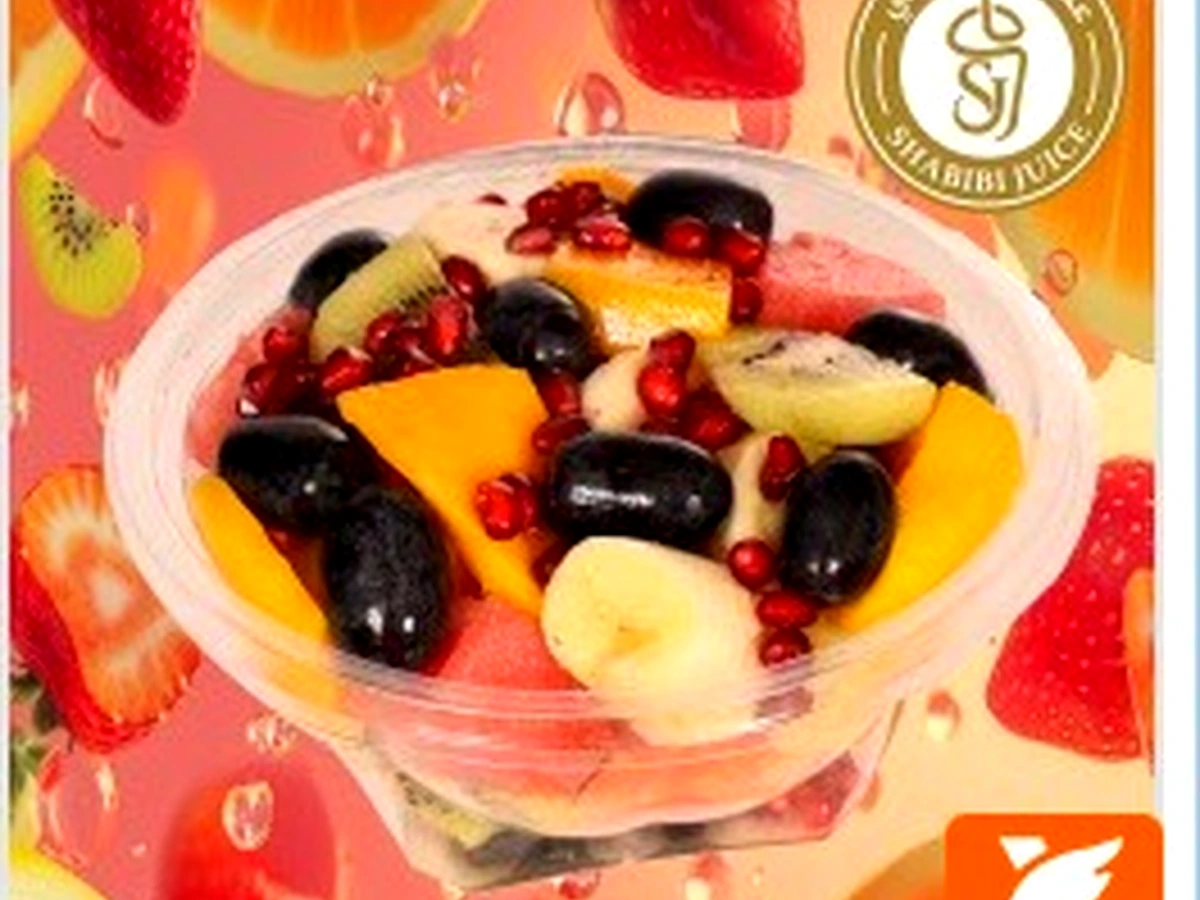 Fresh Shabibi fruit salad with mango, berries and pomegranate